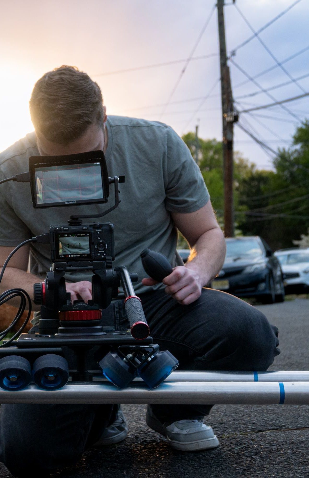Jacob Serrano operating a camera slider on location