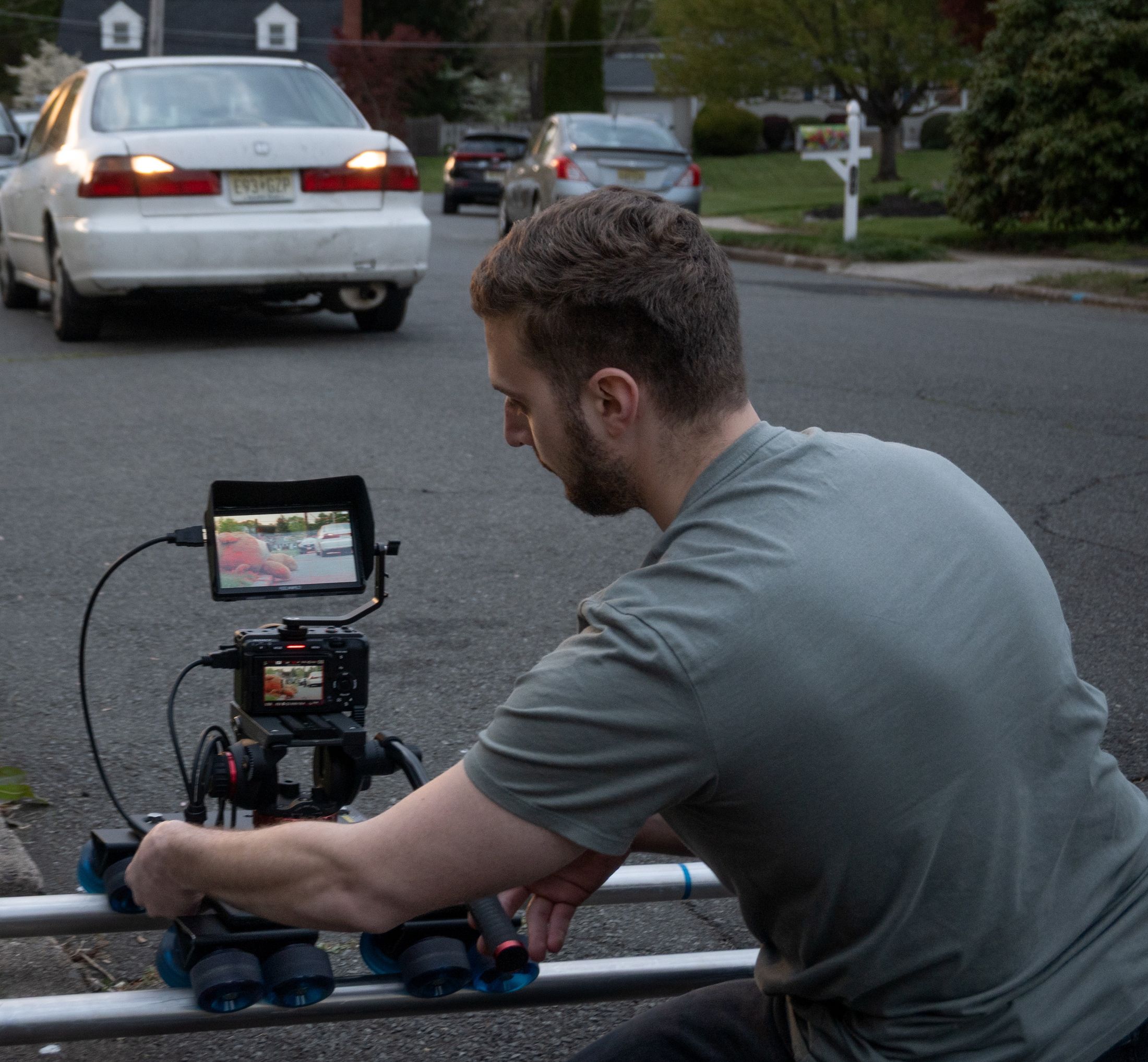 Jacob Serrano on set, running a camera slider rig